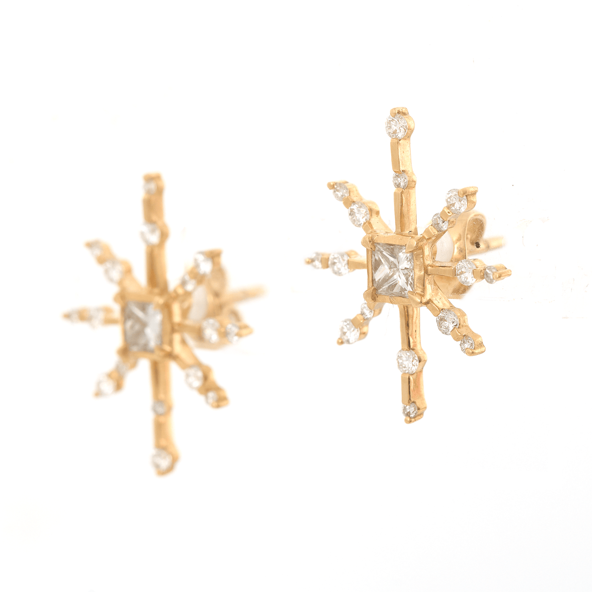 Side view of 18k gold diamond earrings.