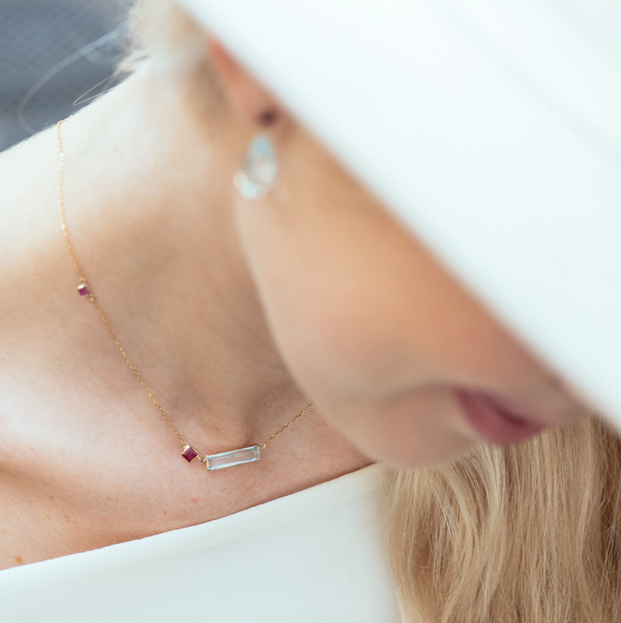 Aquamarine & Ruby Bar fine jewelry Necklace in 18k gold on model 2