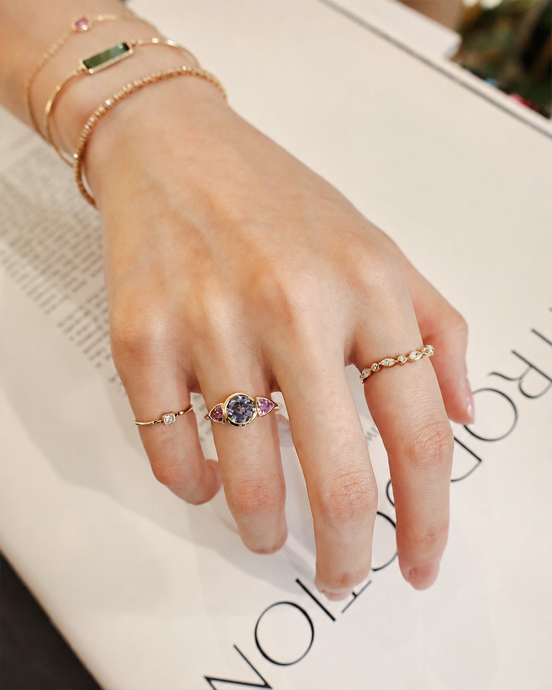 Baby_Blue_Pink_Sapphire_Ring_18K_gold_engagement_ring_on_model_3