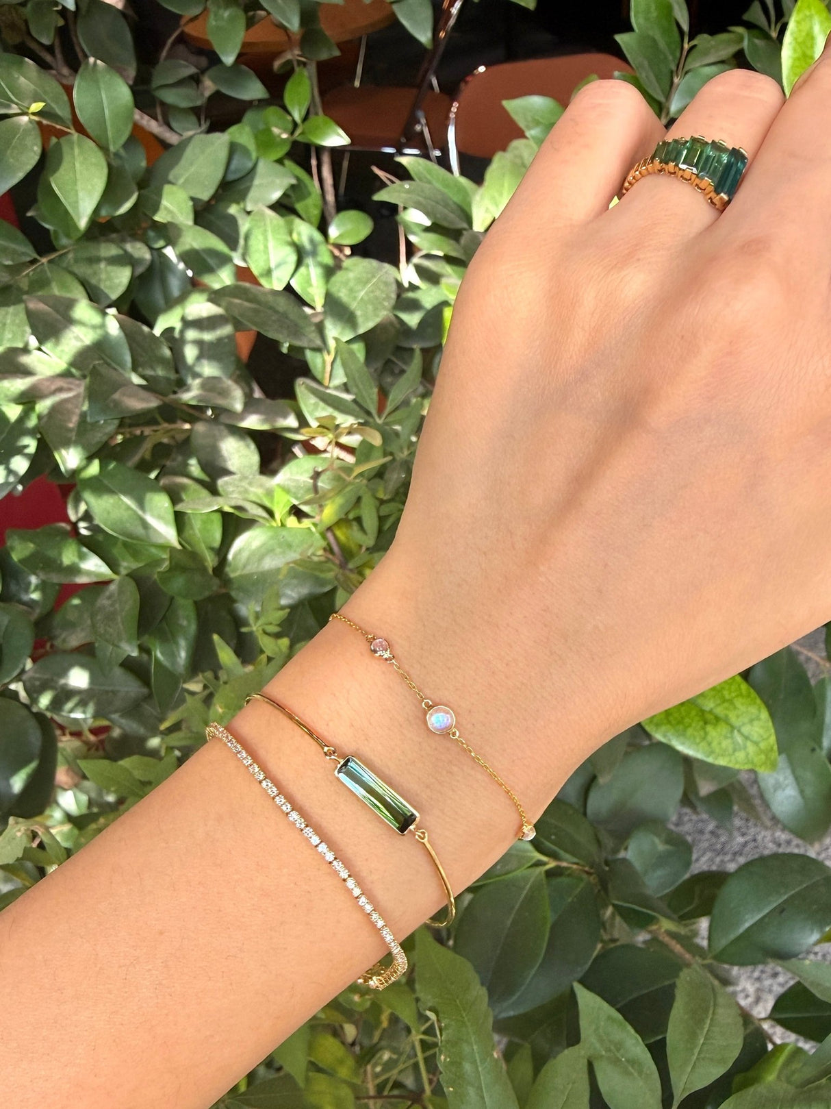 Bi-color watermelon tourmaline bangle 18K gold stackable design on model