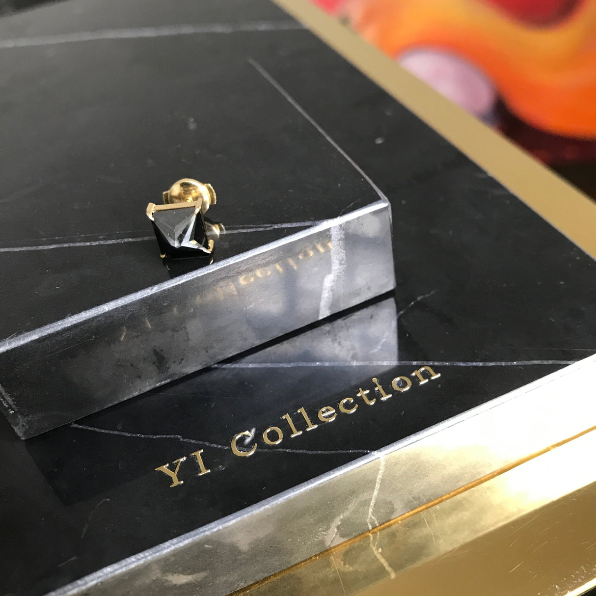 black diamond stud on black marble