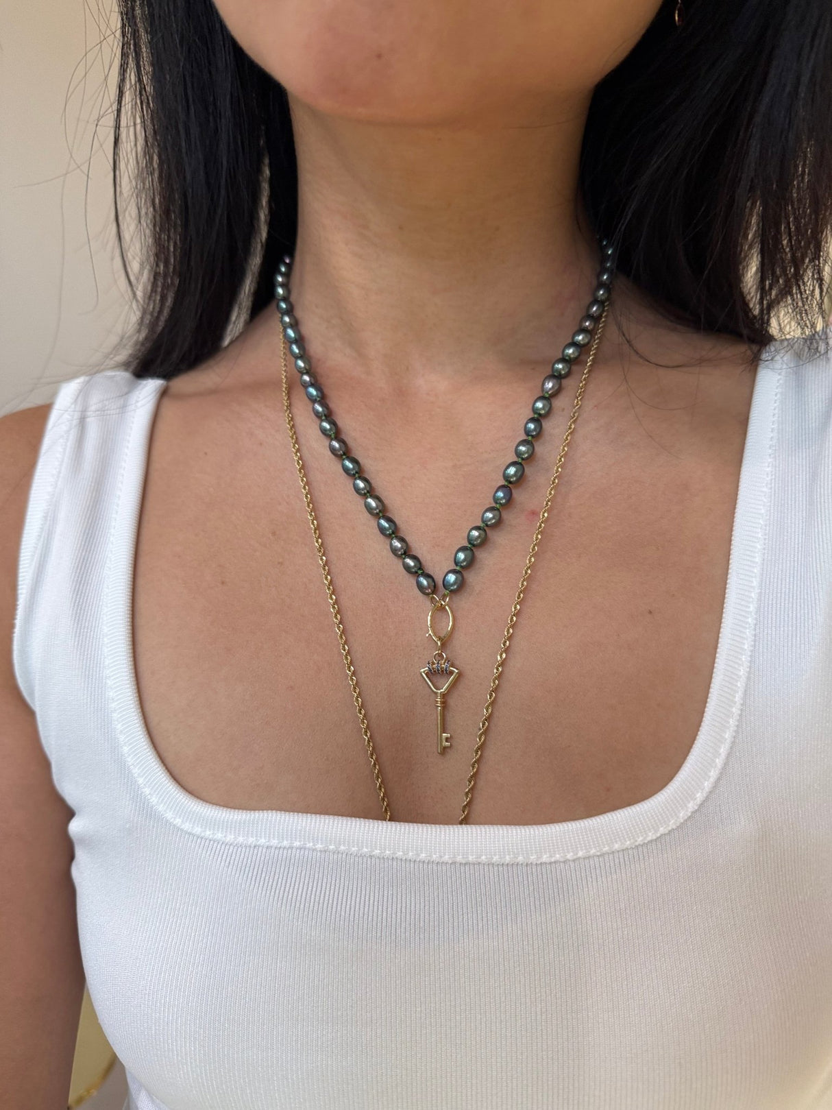 Black Pearl With Fisheye Closure Necklace handmade fine jewelry on model 1