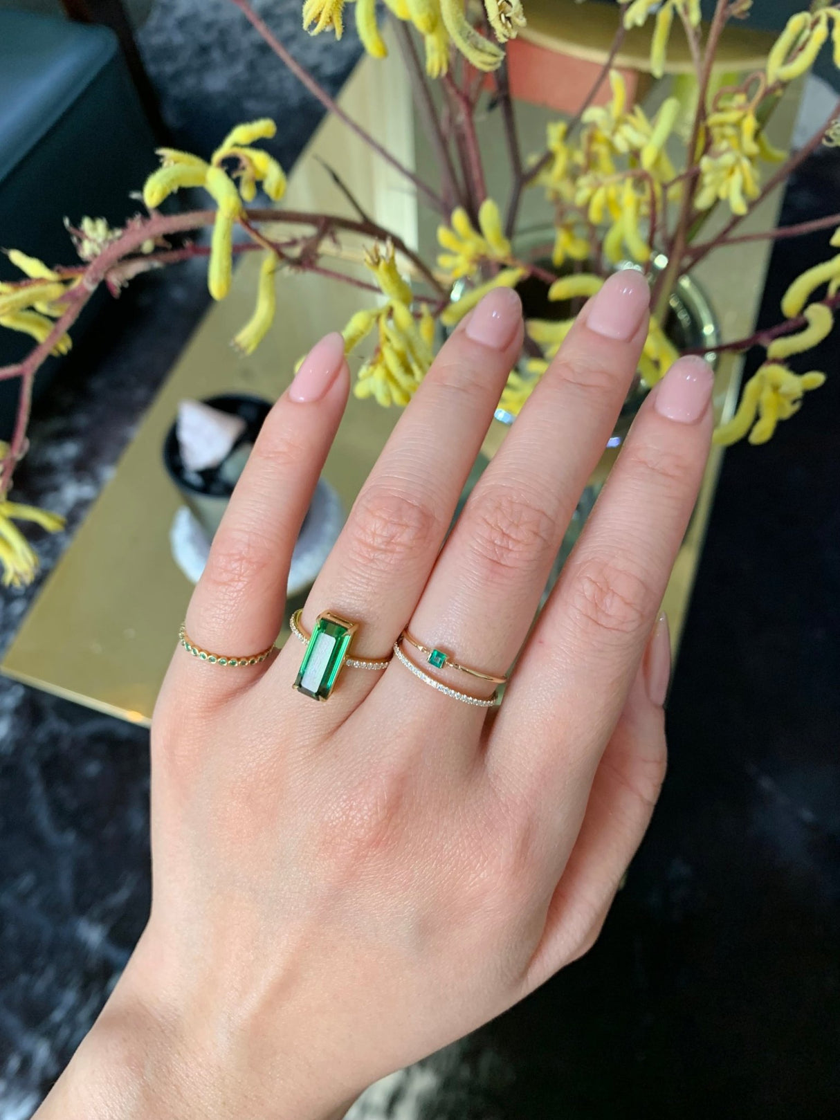 Emerald Bezel Set Infinity Ring 18k gold stackable ring on model