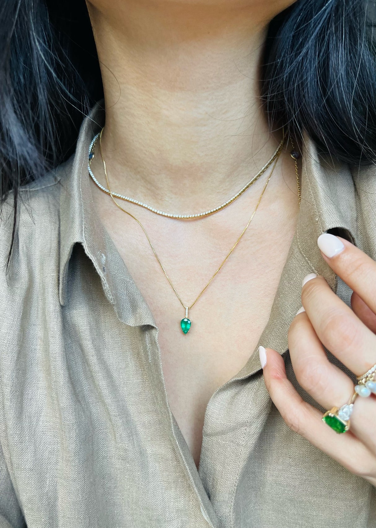 Emerald & Diamond Arrow handmade Necklace in 18k gold on model