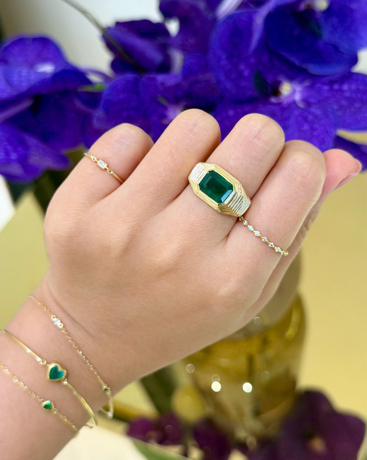 Emerald_Pyramid_Ring_18K_gold_engagement_ring_on_model_2
