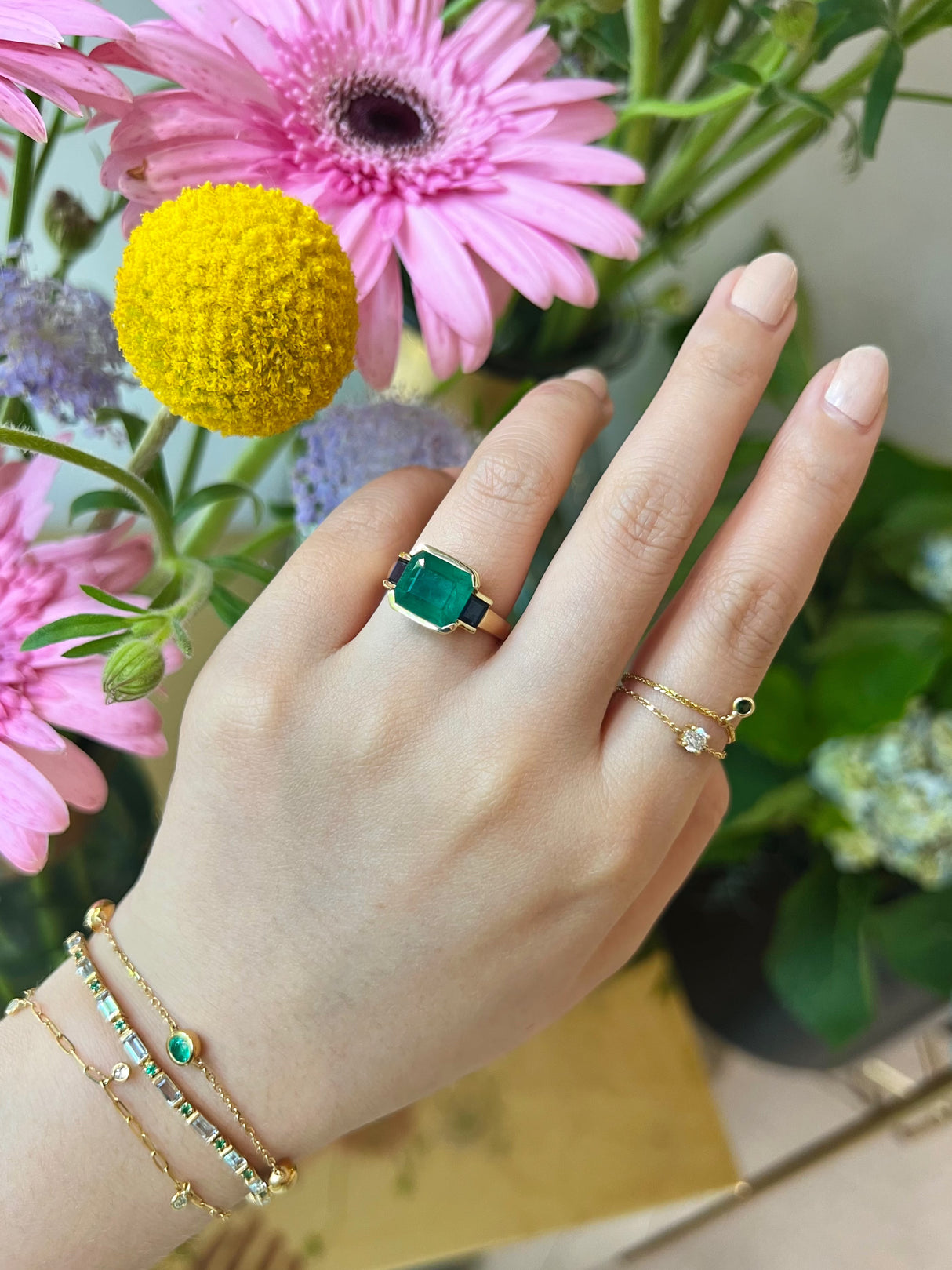 Emerald & Sapphire Tonal Deco Bar Spring Ring 18k gold engagement ring on model