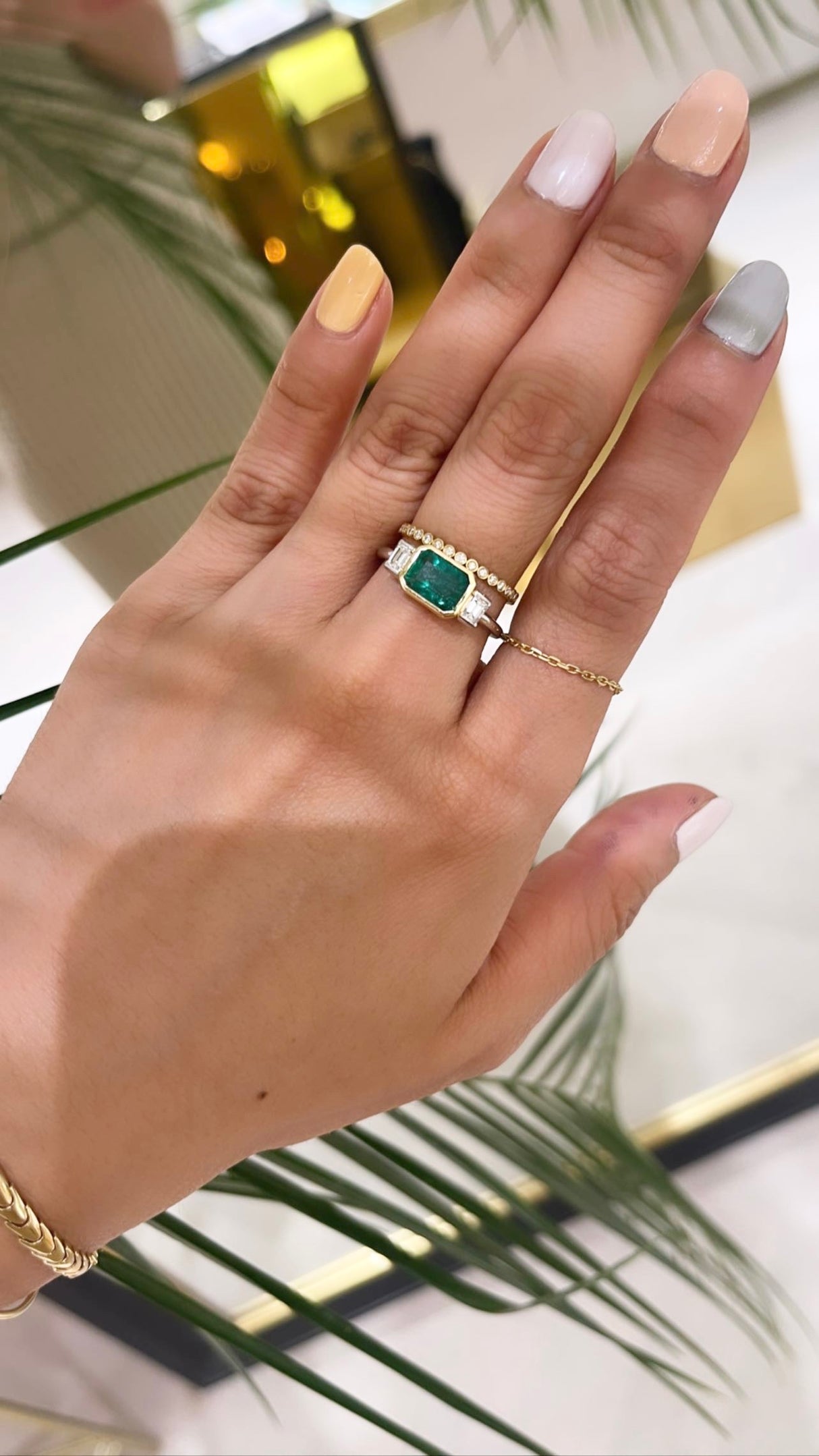 Emerald and diamond forever ring 18k gold engagement ring on model