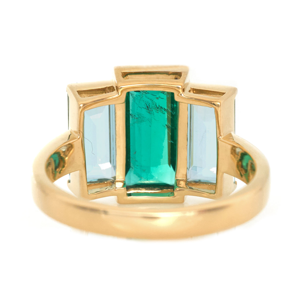 Exquisite handcrafted 18k ring by female artisans in our Bangkok studio. Vivid green emerald paired with aquamarines from Madagascar and emeralds from Gemfields. Sustainably sourced and adds just the right pop of color.