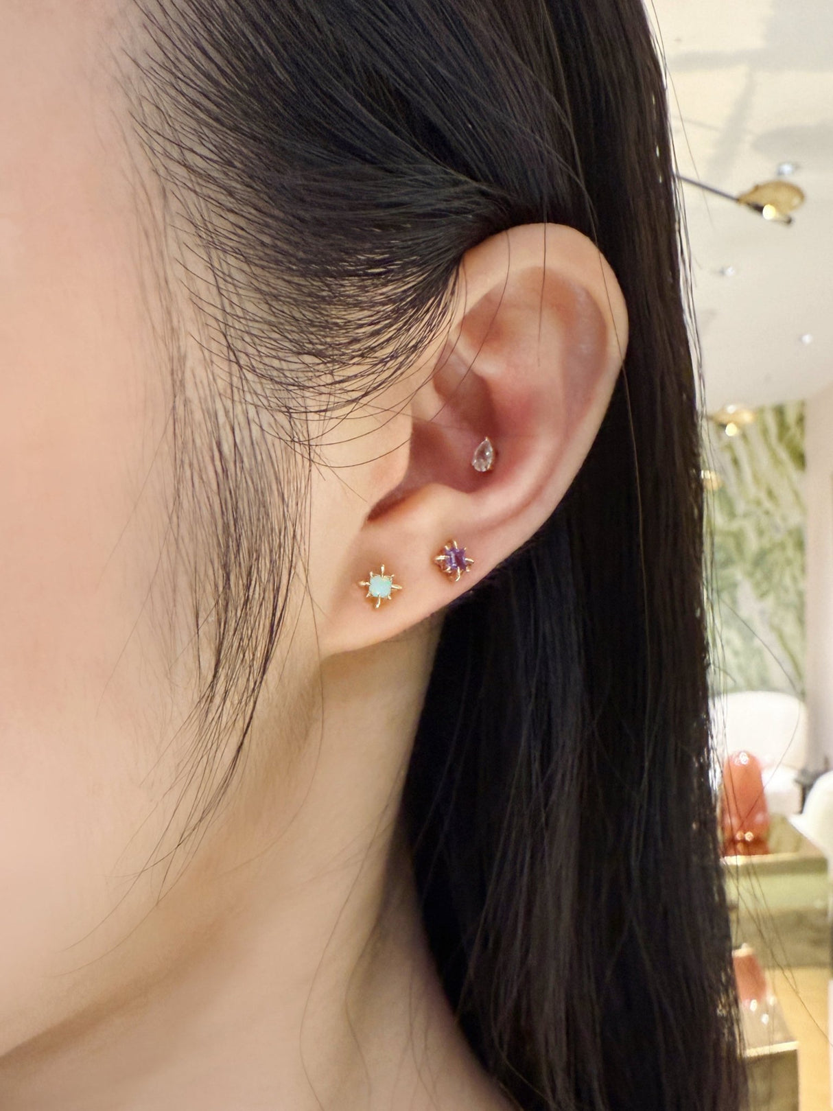 Australian opal birthstone earrings in 14k Worn on model