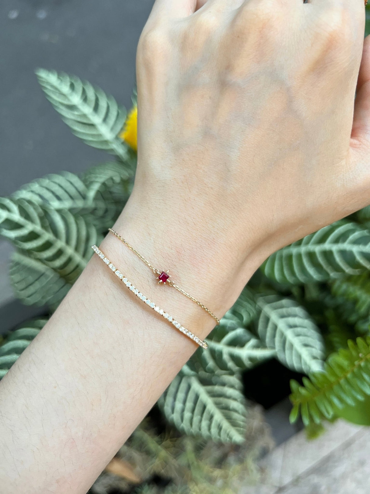 July Birthstone Ruby Bracelet 14k gold stackable design on model