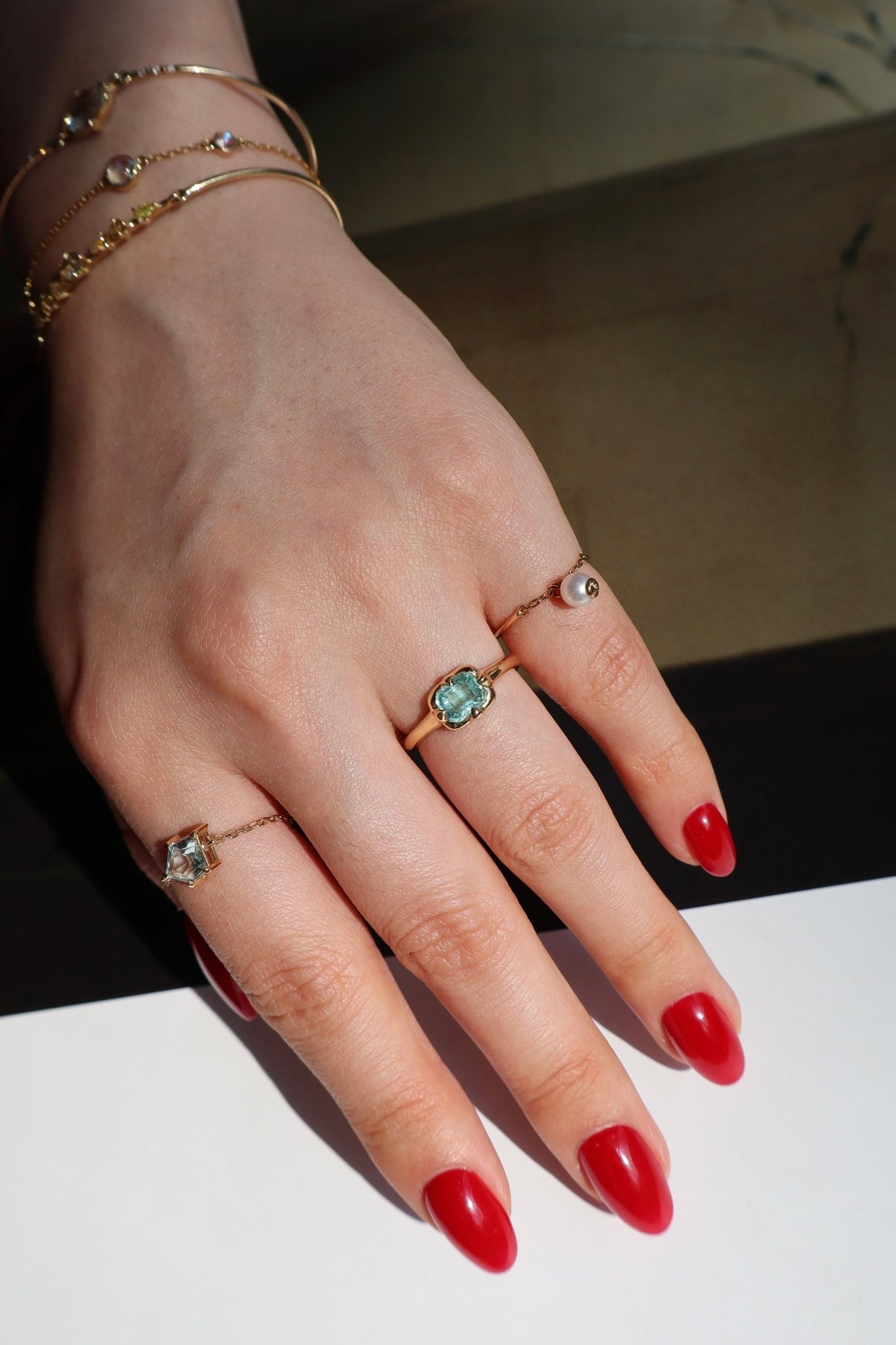 Paraiba Tourmaline Compass Ring 18K engagement ring on model 1