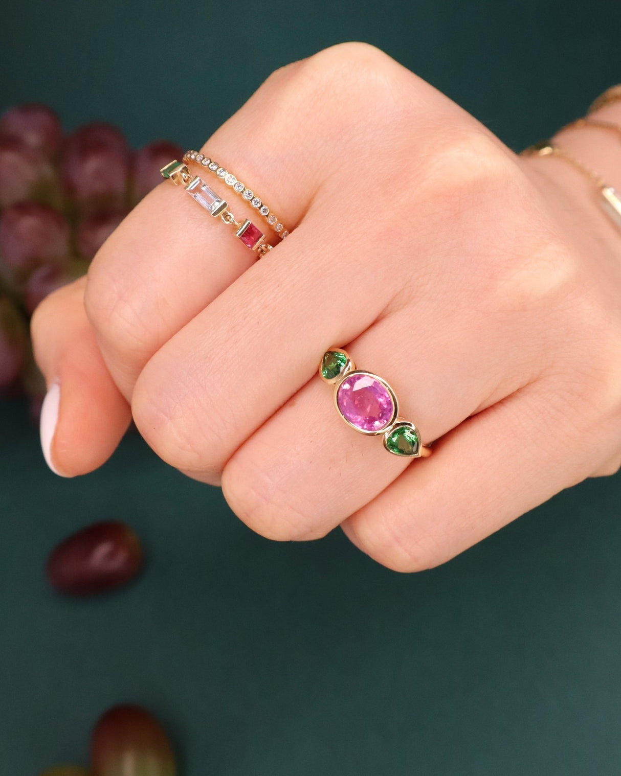 Pink_Sapphire_Tsavorite_Ring_18K_gold_engagement_ring_on_model_1