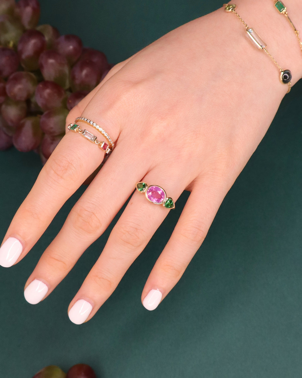 Pink_Sapphire_Tsavorite_Ring_18K_gold_engagement_ring_on_model_2
