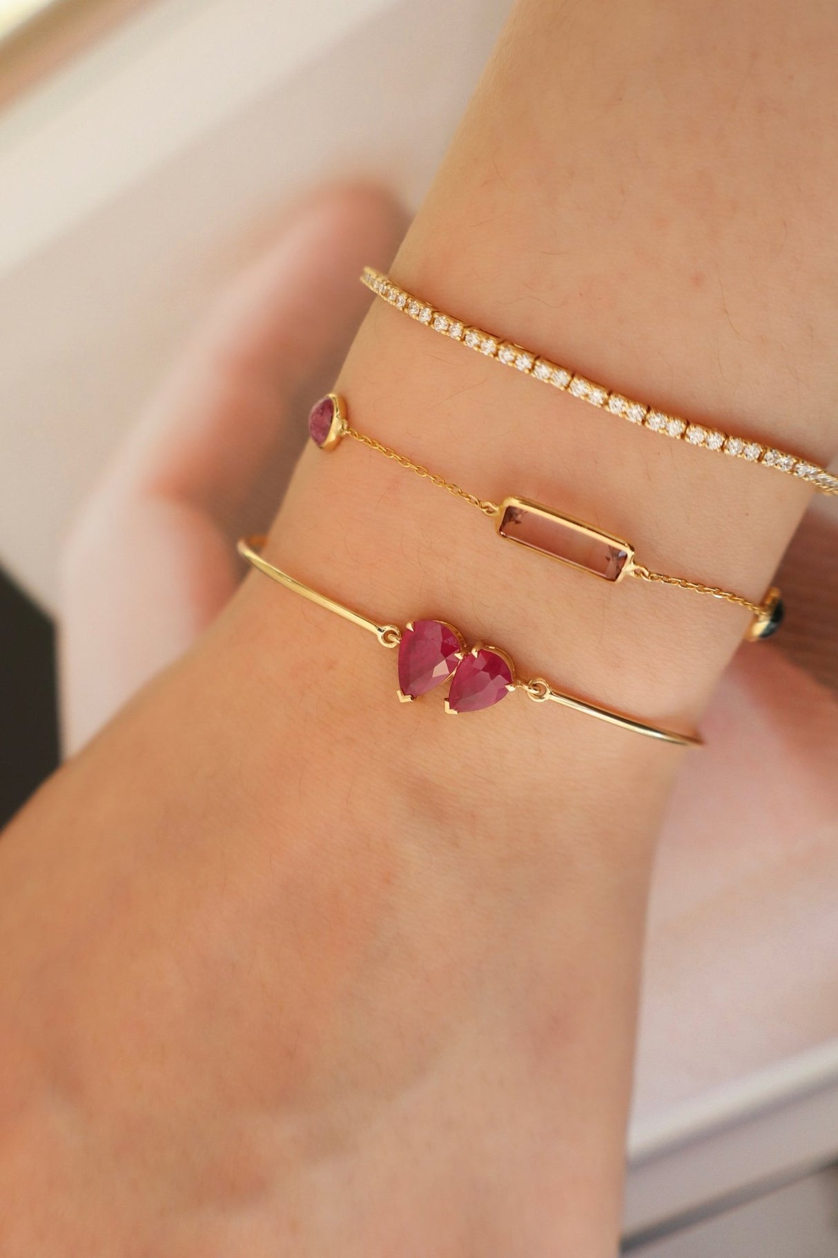 Ruby Double Pear Bangle 18k gold stackable design on model 3