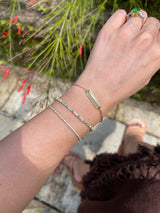 Aquamarine & Emerald Spring Tennis Bracelet 18k gold stackable design on model 2