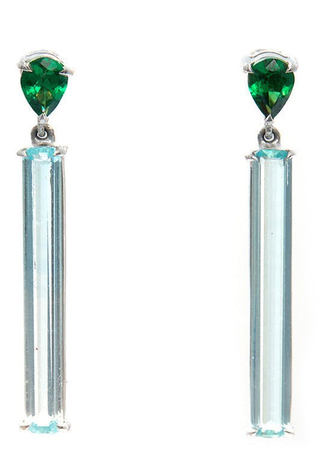 A pair of linear bar earrings featuring top green tsavorite and bottom clear aquamarine gemstones, set in platinum mounting. Handmade by female artisans with sustainably mined gemstones. 
