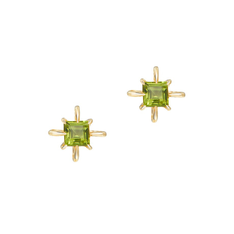 Pair of gold earrings with green peridot gemstones on a white background