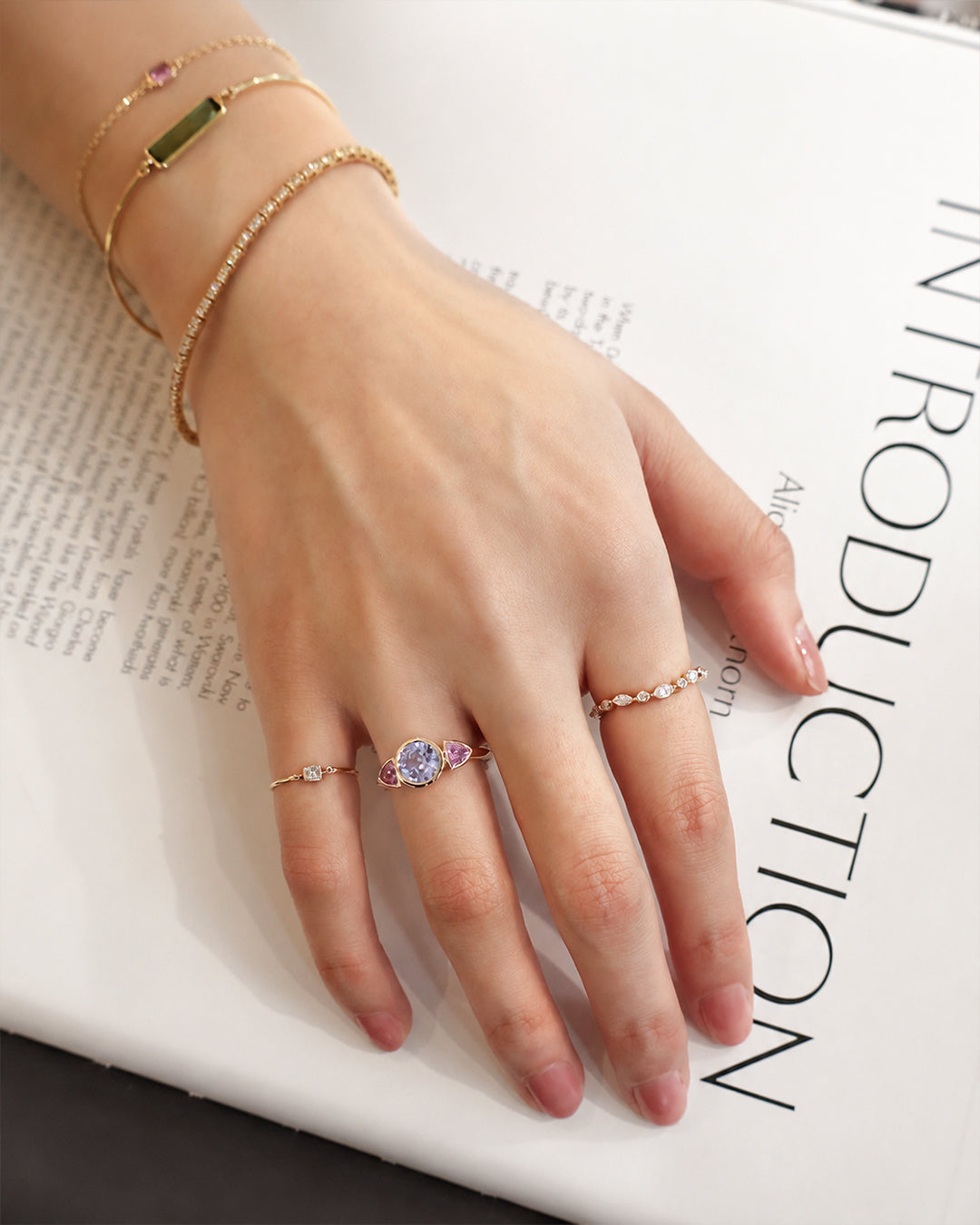Baby_Blue_Pink_Sapphire_Ring_18K_gold_engagement_ring_on_model_1