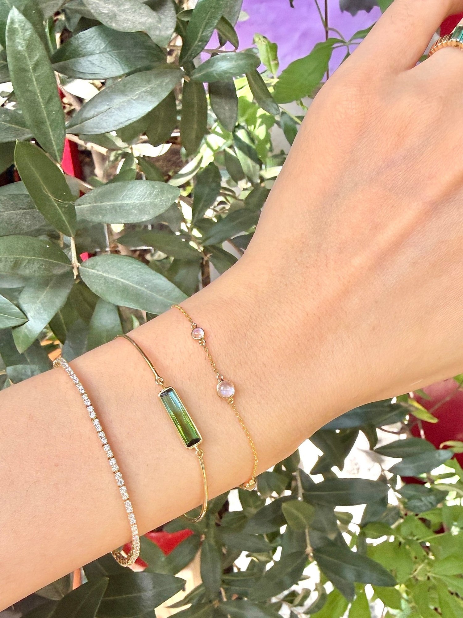 Bi-color watermelon tourmaline bangle 18K gold stackable design on hand