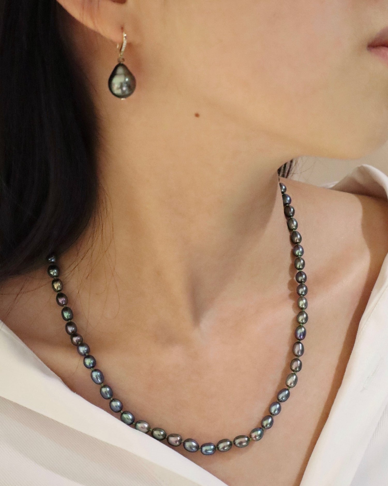 Black Pearl With Fisheye Closure Necklace handmade fine jewelry on model 2