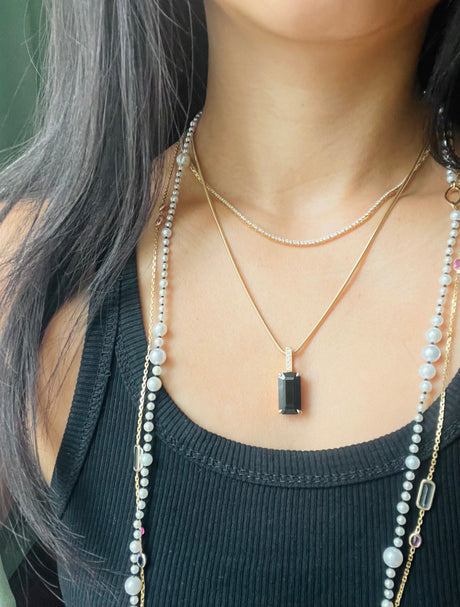 Black Tourmaline And Diamond Protection Bar Pendant handmade Necklace in 18k gold on model