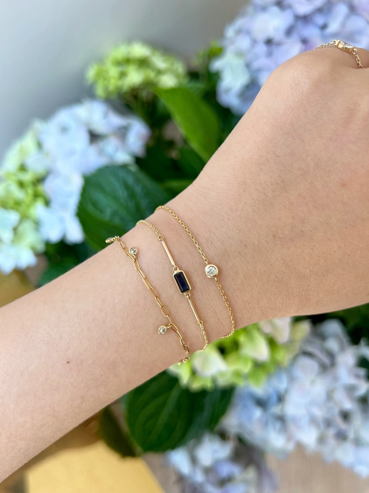 Blue Sapphire Baguette Bar Bracelet 18k gold stackable design on model