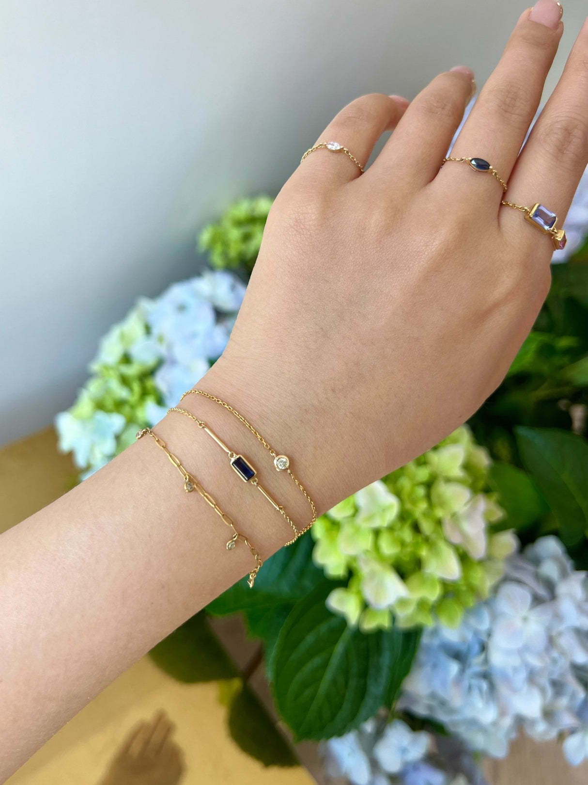 Blue Sapphire Baguette Bar Bracelet 18k gold stackable design on model 2