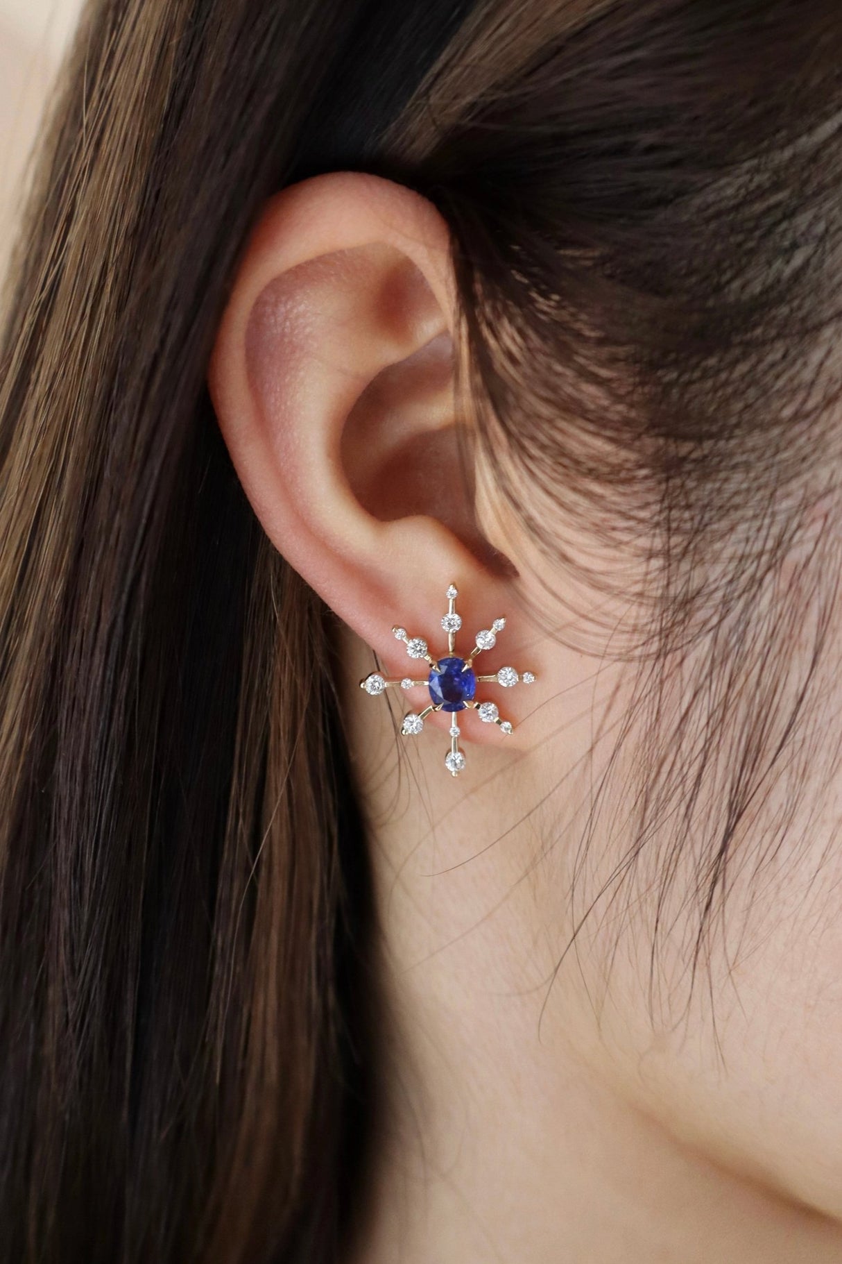 Blue Sapphire Starburst Earrings 18k gold stackable design on model