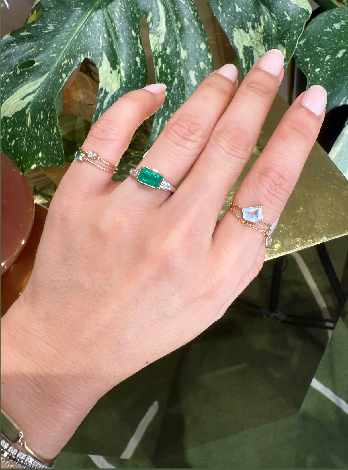 Brazilian Emerald & Diamond East West Ring 18k gold engagement ring on model