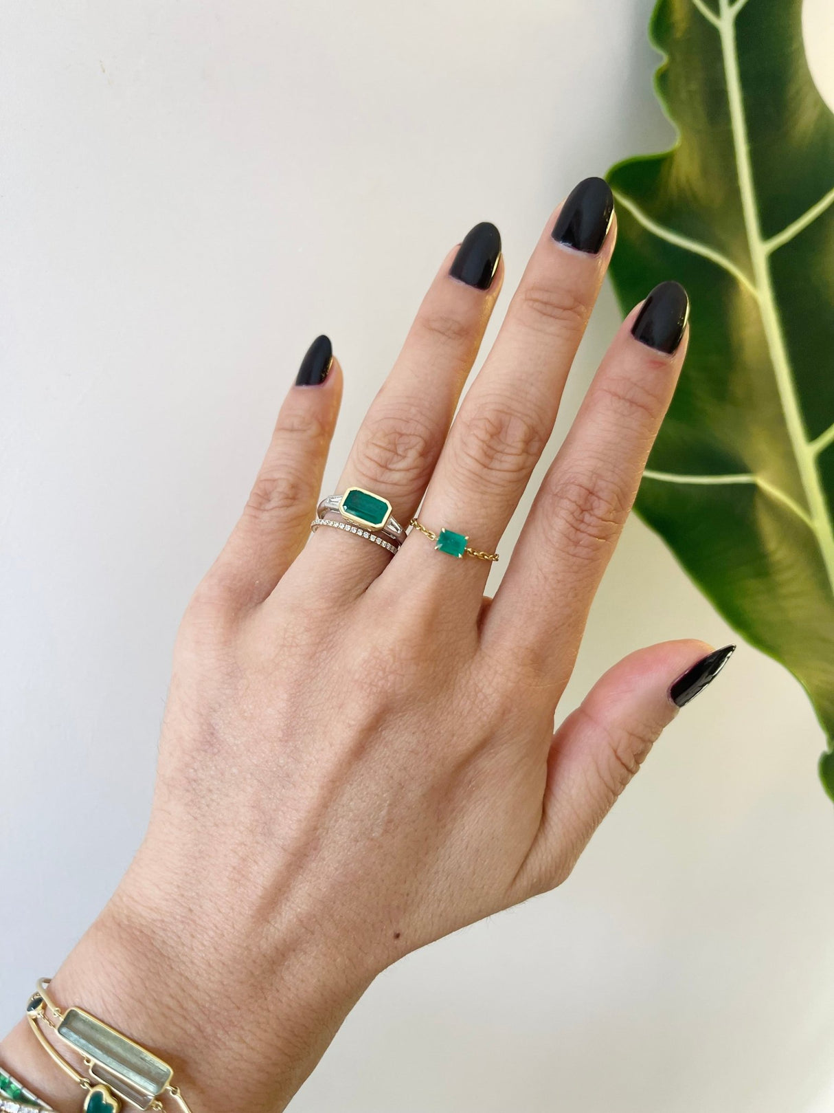 Brazilian Emerald & Diamond East West Ring 18k gold engagement ring on model