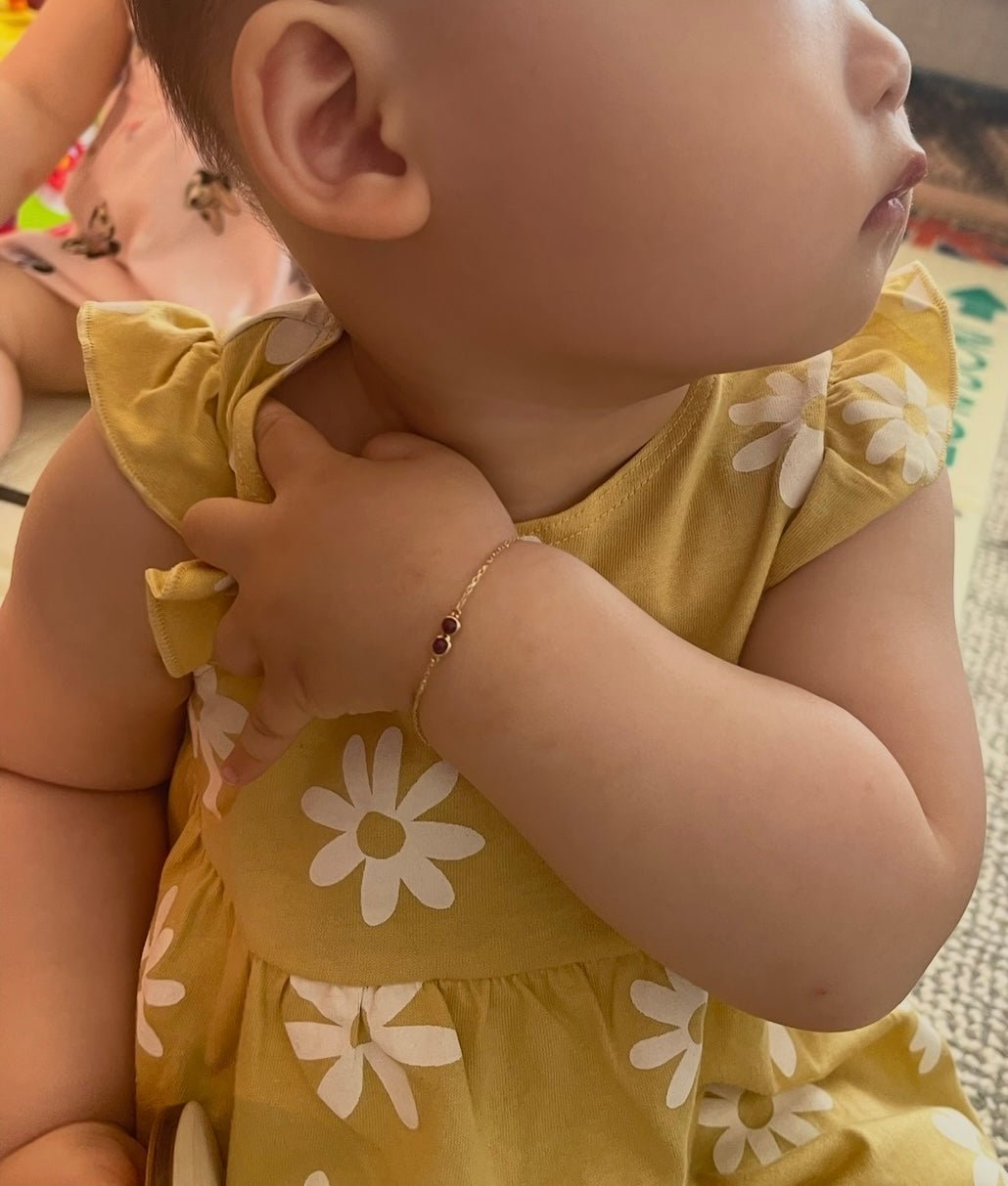 Double Happiness Ruby Baby Bracelet 18k gold stackable design on model 2