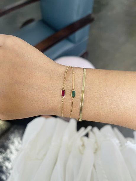 Emerald Baguette Bar Bracelet 18k gold stackable design on model