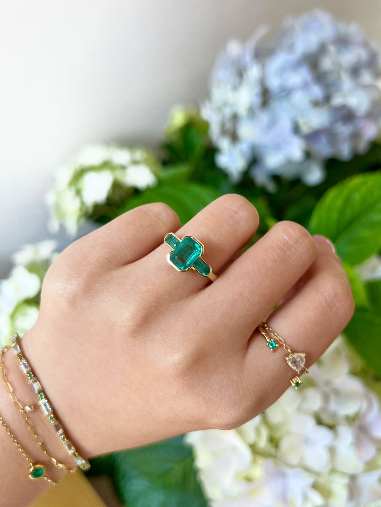 Emerald Bar Ring 18k gold engagement ring on model 