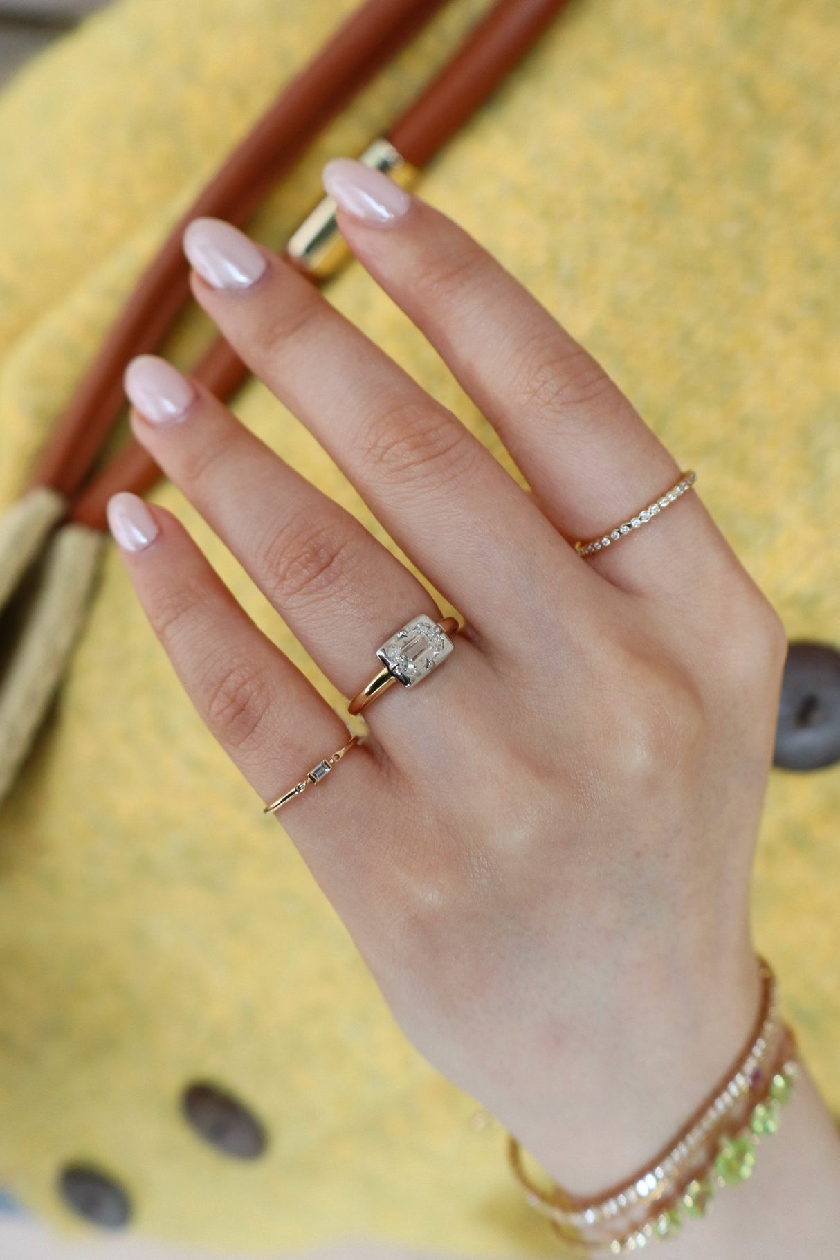 Emerald Cut Diamond Compass Ring 18k gold engagement ring on model 2