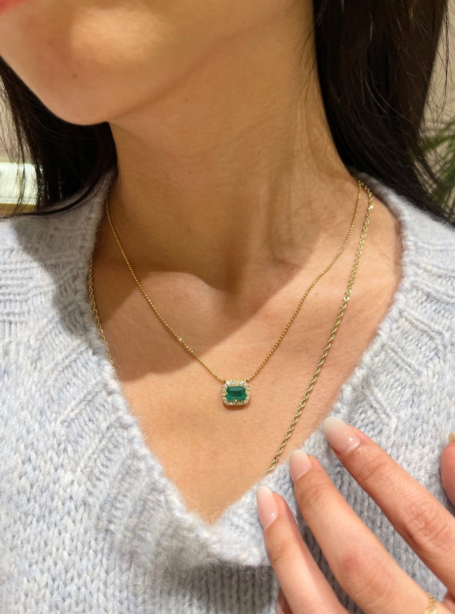 Emerald & Diamond Frame fine jewelry Necklace in 18k gold on model