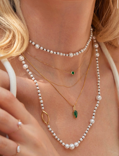 Emerald Petite Button handmade Necklace in 18k gold on model