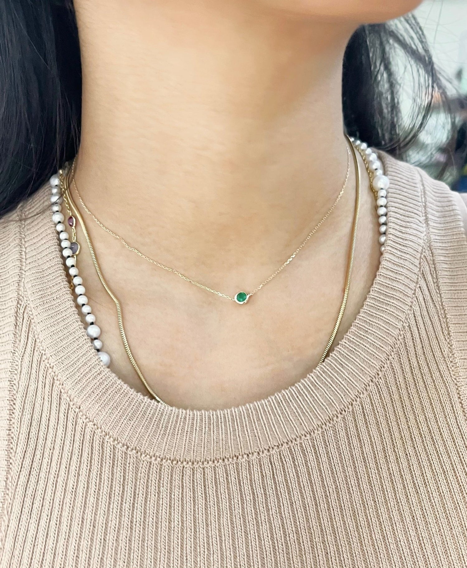 Emerald Petite Button fine jewelry Necklace in 18k gold on model 2