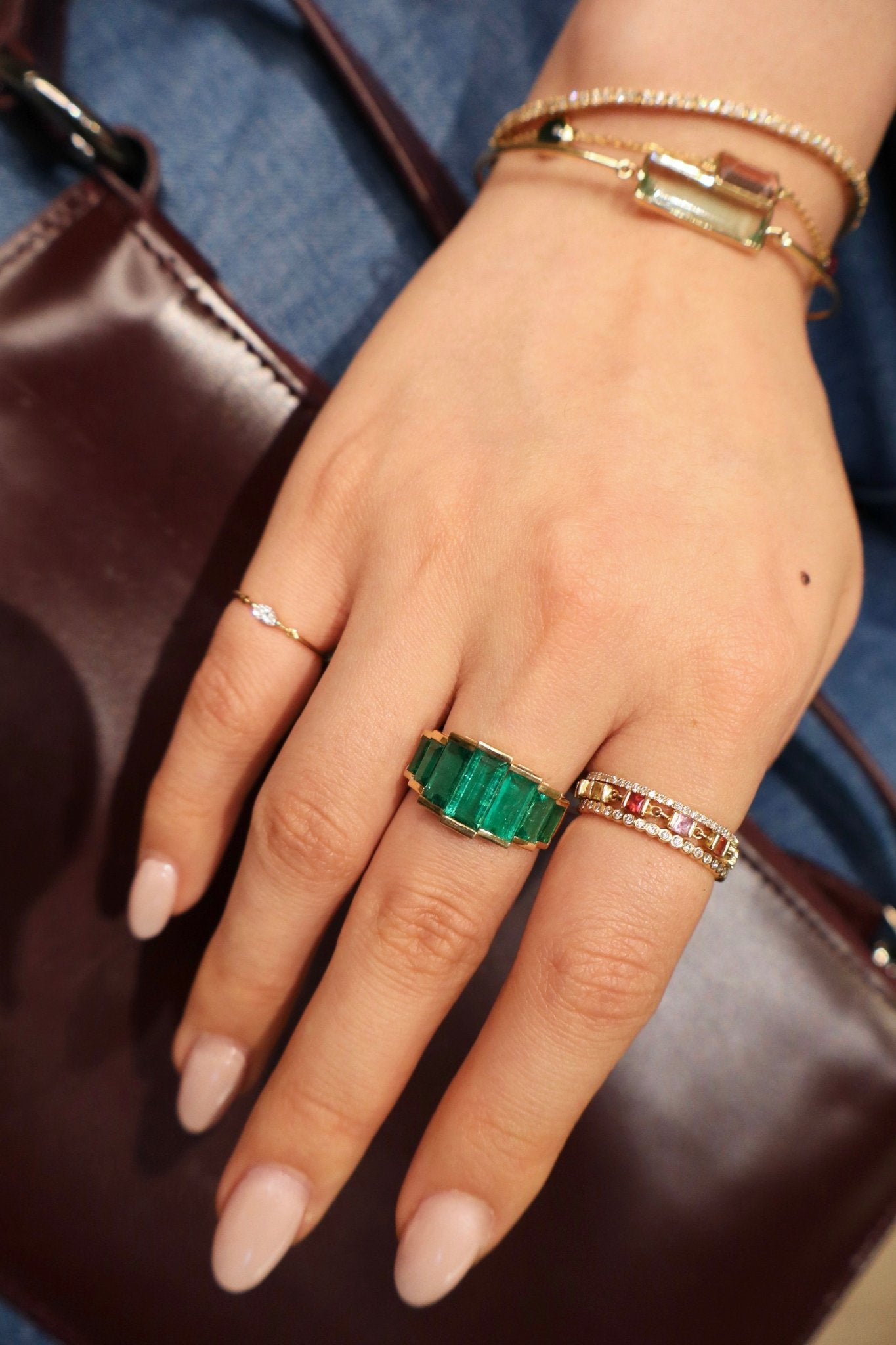 Emerald Rhythm Supreme Ring 18k gold engagement ring on model