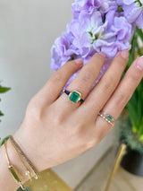 Emerald & Royal Blue Sapphire Eternal Ring 18k gold engagement ring on model