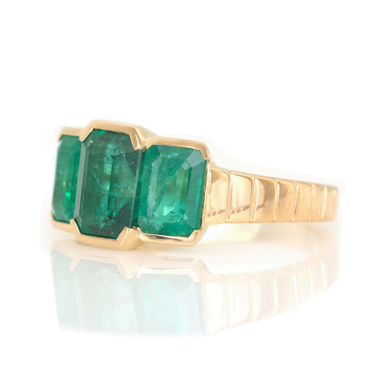 Emerald Tonal Rhythm Ring 18k gold engagement ring side view