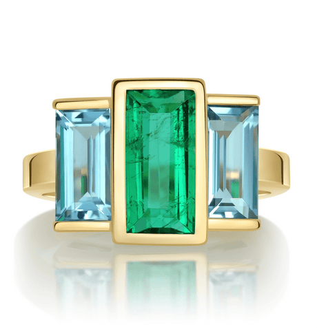 Exquisite handcrafted 18k ring by female artisans in our Bangkok studio. Vivid green emerald paired with aquamarines from Madagascar and emeralds from Gemfields. Sustainably sourced and adds just the right pop of color. 