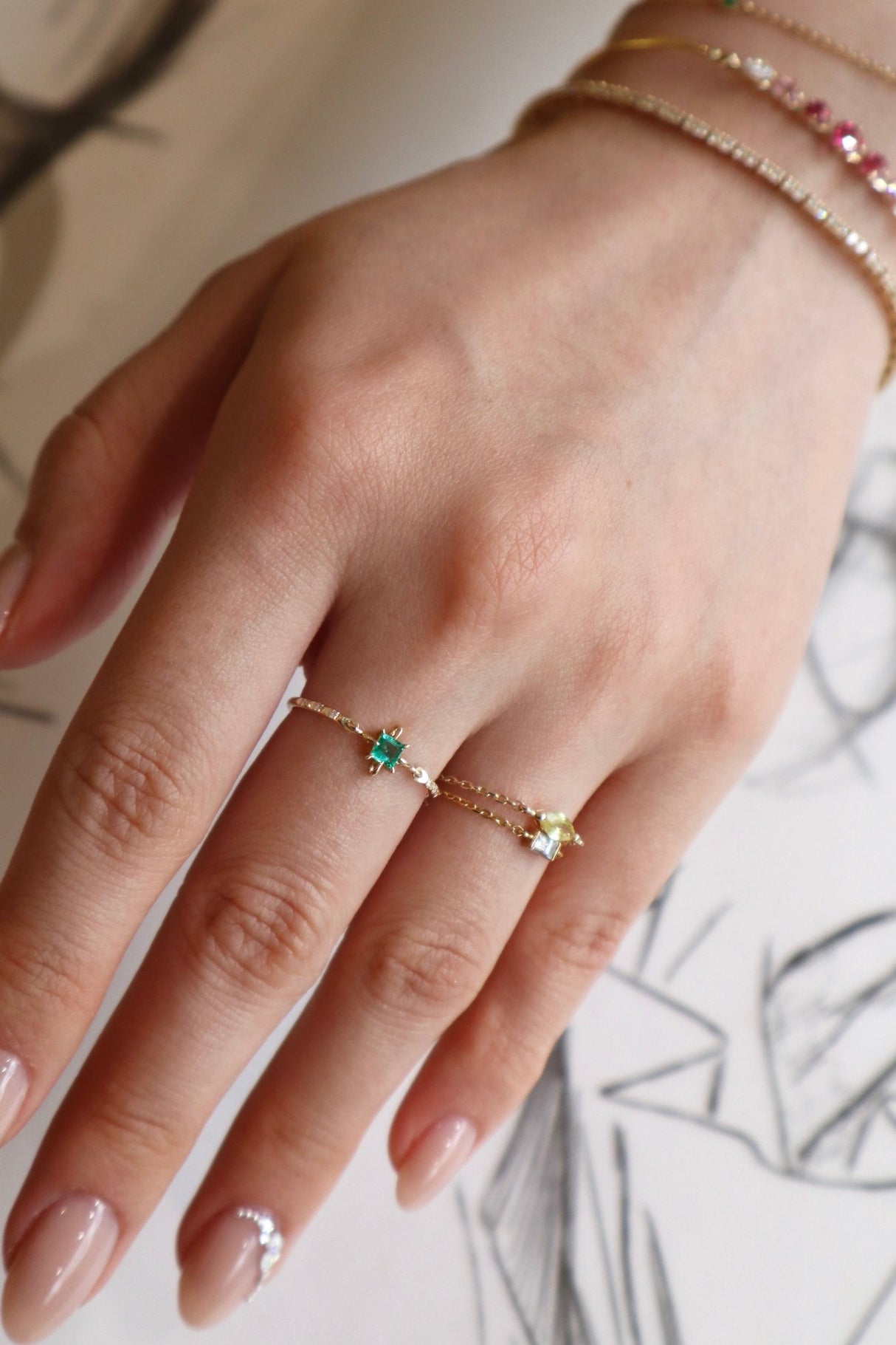 Emerald birthstone petite circle diamond ring 14k gold stackable ring on model