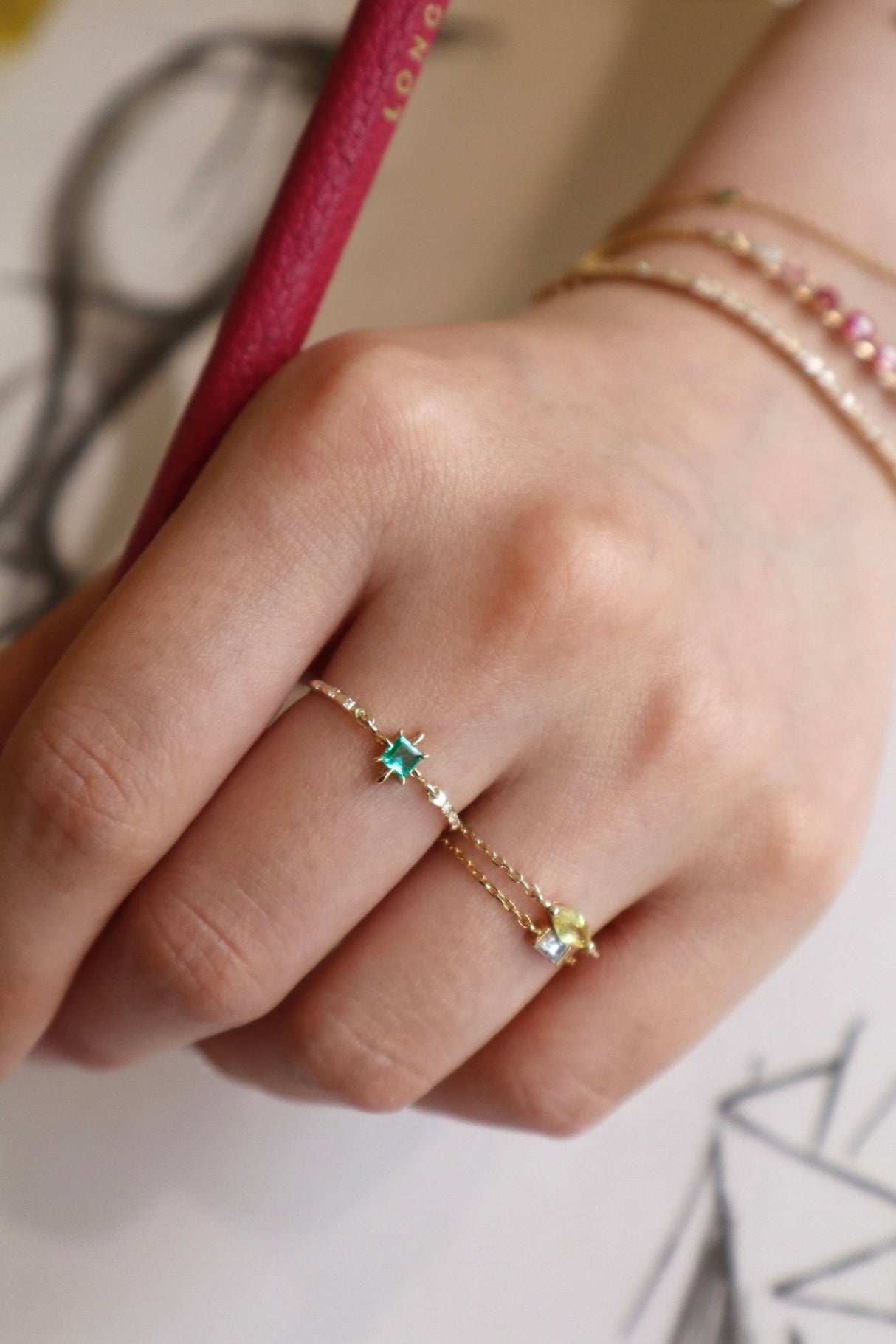 Emerald birthstone petite circle diamond ring 14k gold stackable ring on model