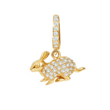 Gold rabbit-shaped pendant with diamond accents on a white background