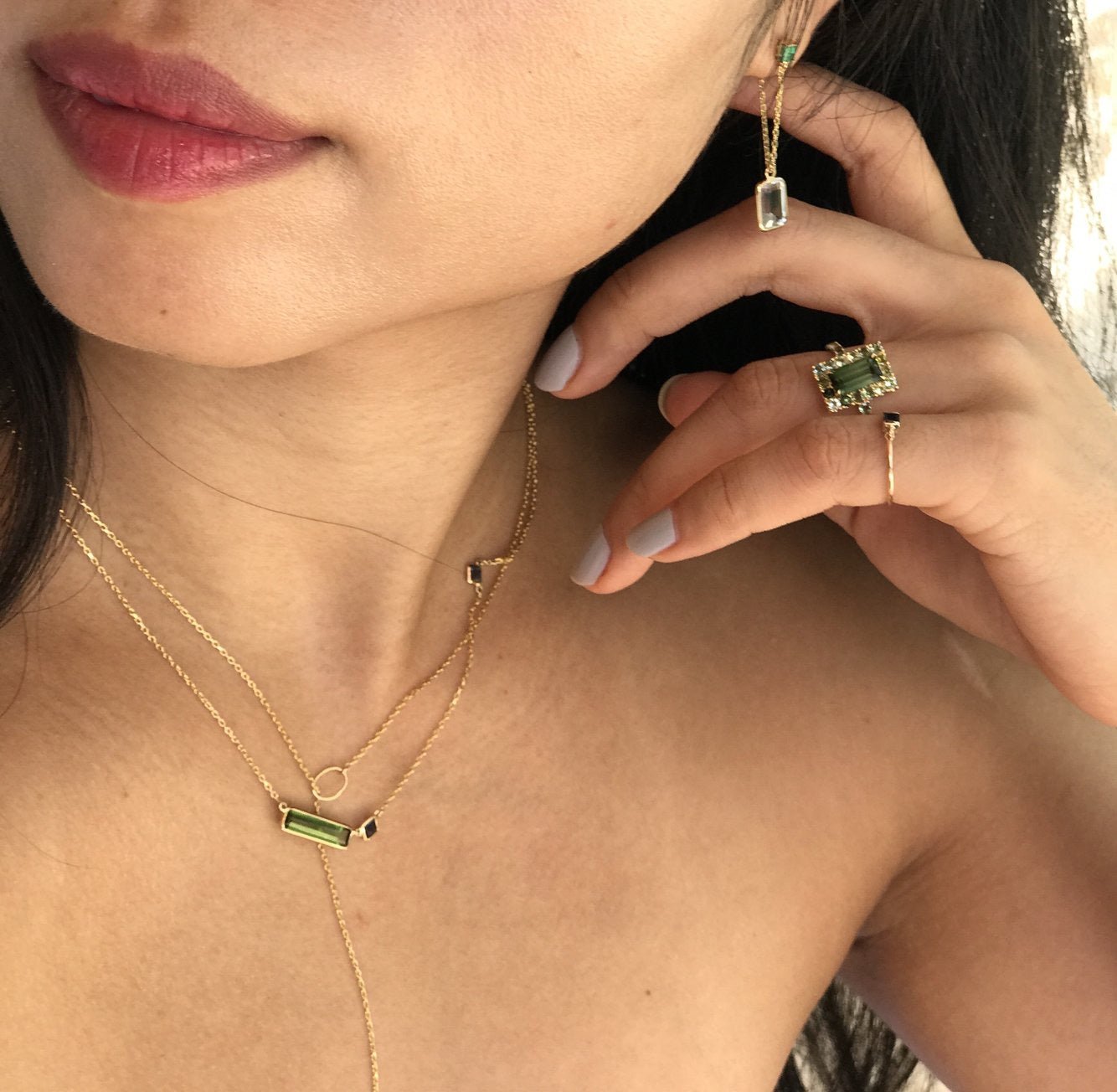 Green Tourmaline & Sapphire Bar Necklace in 18k gold handmade fine jewelry on model