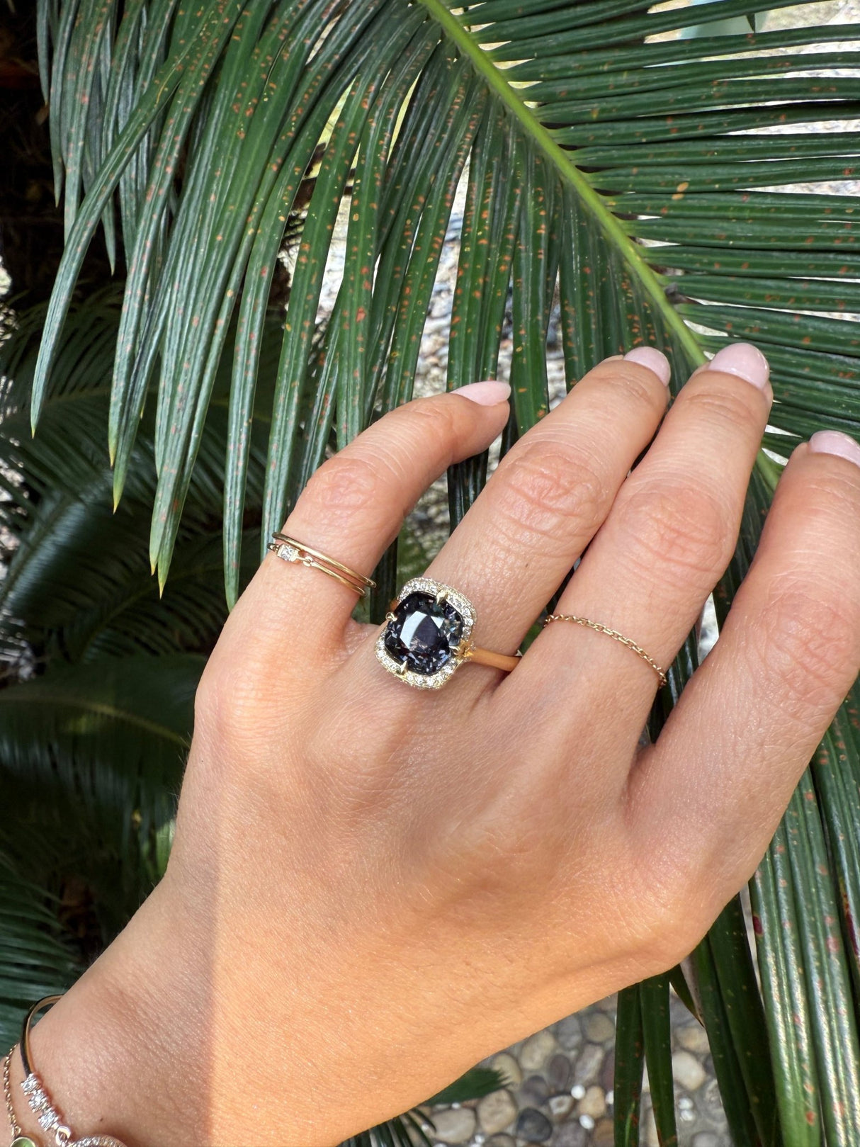 Grey Spinel Aurora Ring 18k gold engagement ring on model.