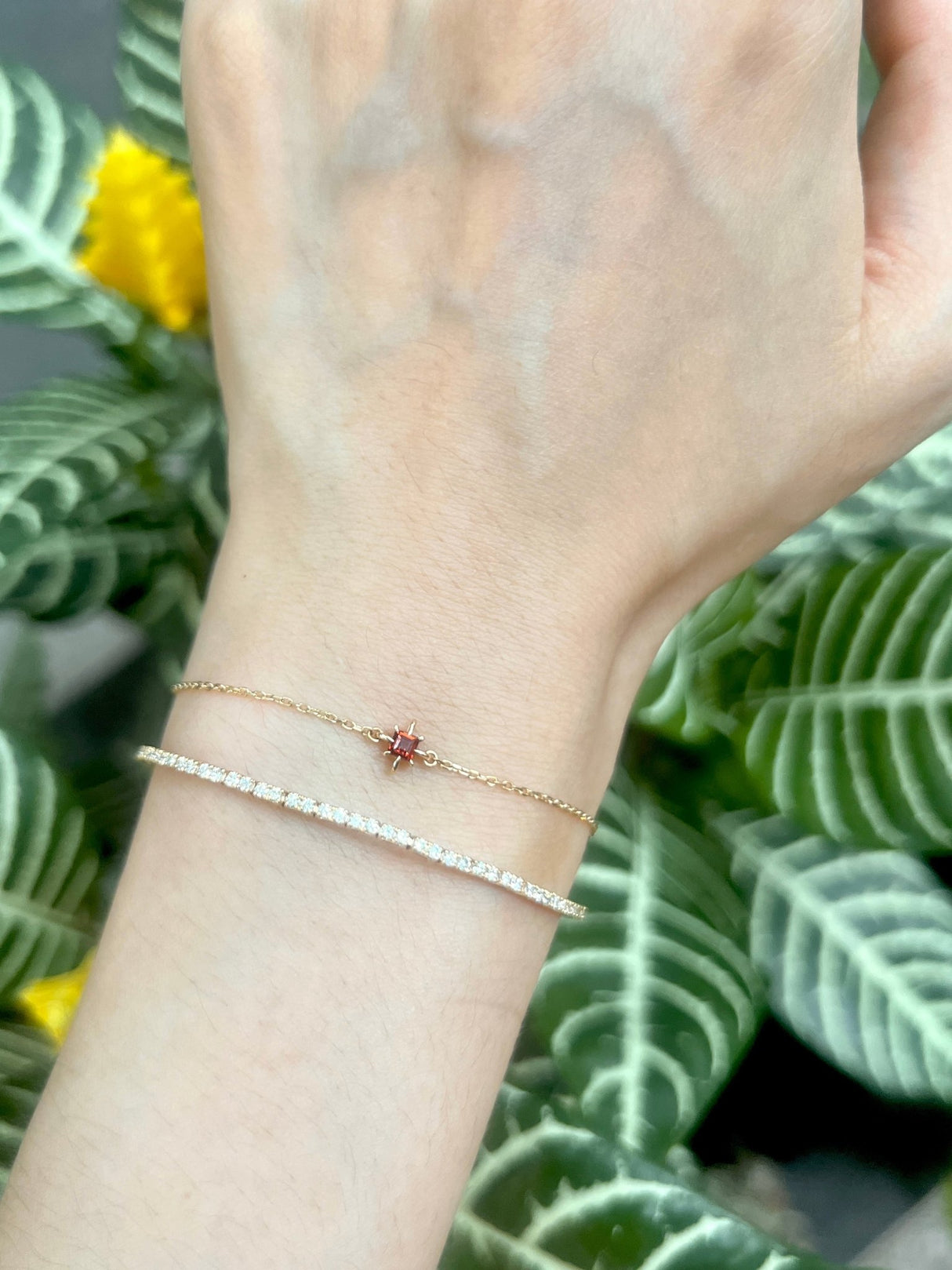 January Birthstone Garnet Bracelet 14k gold stackable design on model