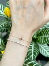 January Birthstone Garnet Bracelet 14k gold stackable design on model