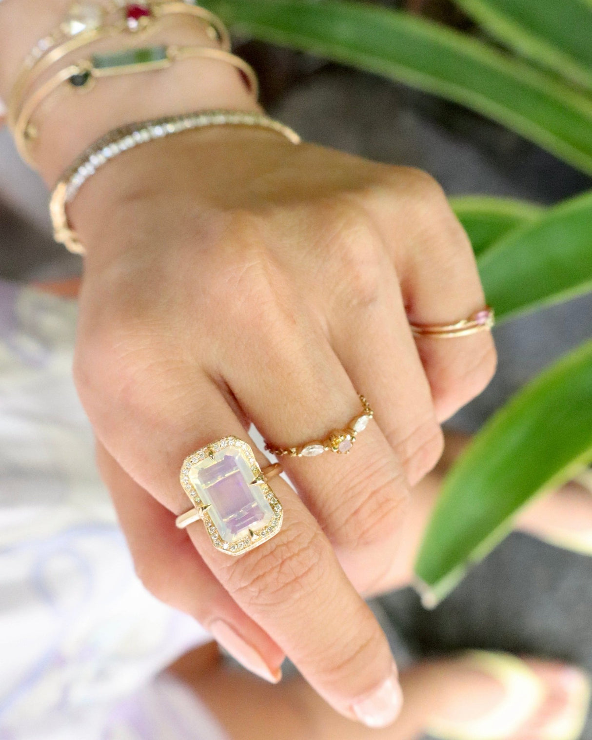 Jelly_Opal_Aurora_Ring_Emerald_Cut_18K_gold_engagement_ring_on_model_2