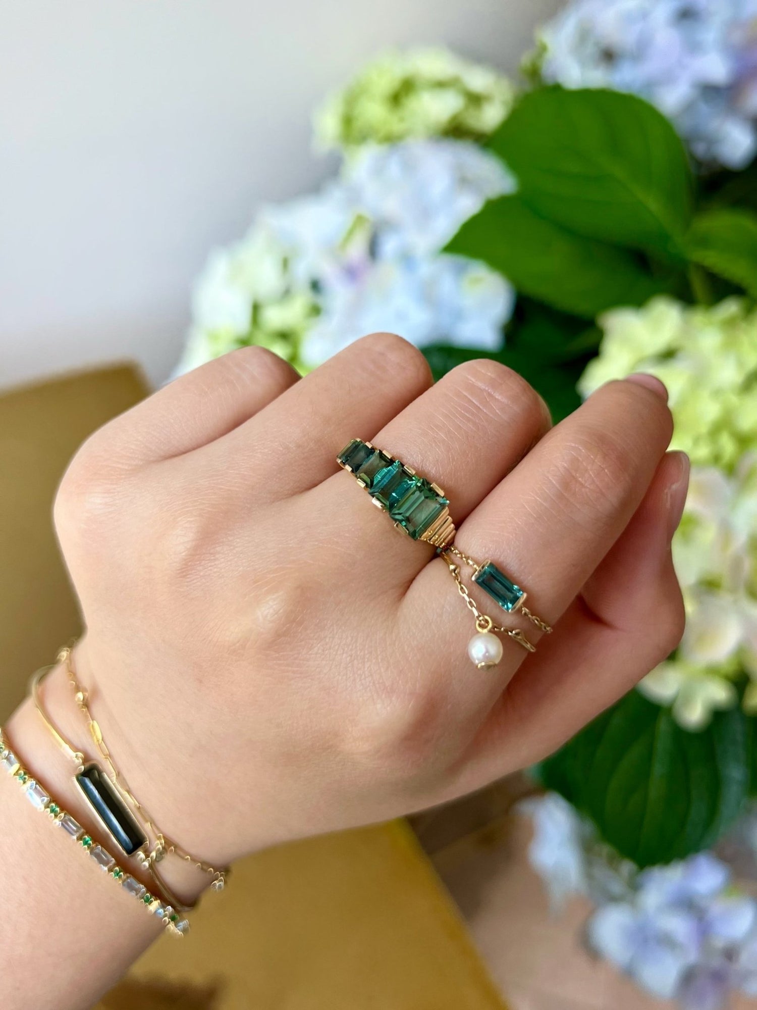 Lagoon Tourmaline Baguette Crescendo Ring 18K engagement ring on model 2